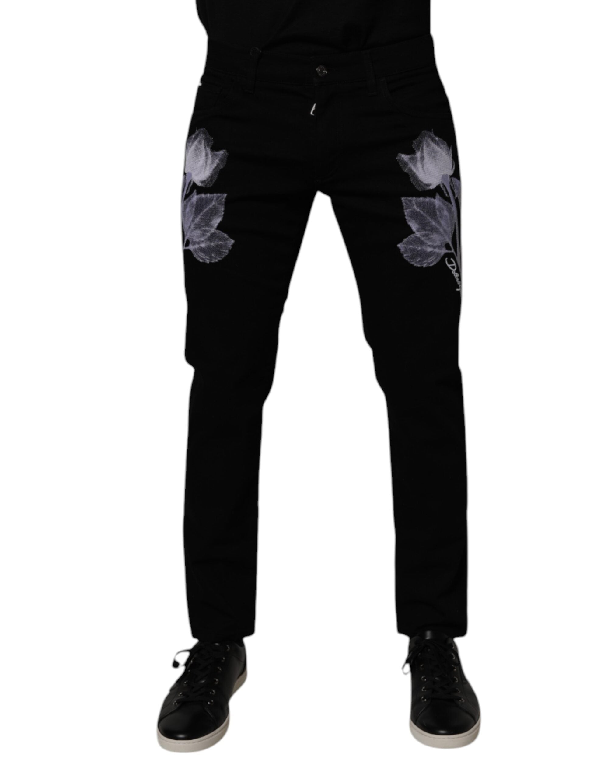 Jeans homme Dolce & Gabbana en coton noir avec motif floral, coupe skinny, en denim ajusté et élégant.