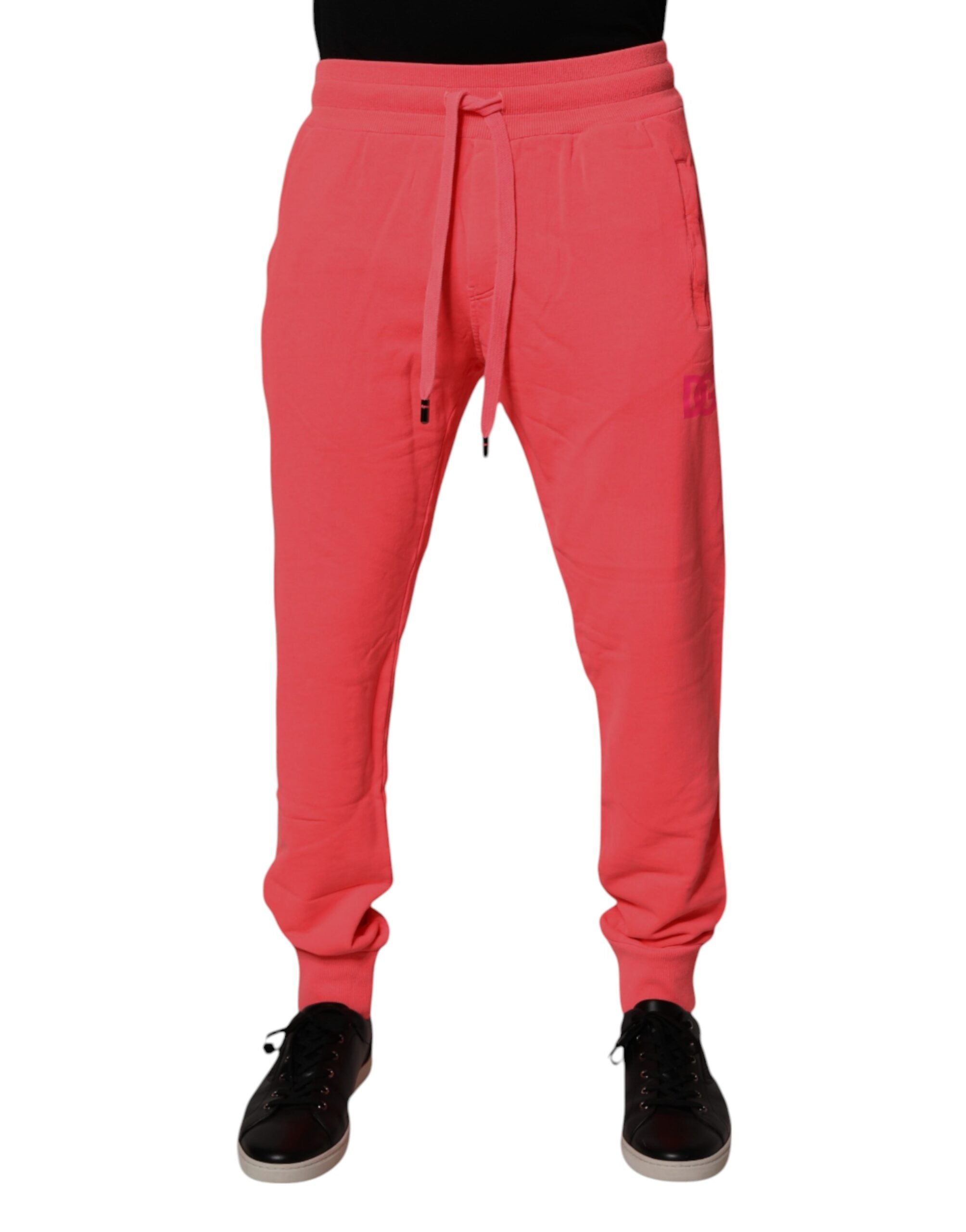 Pantalon jogging homme Dolce & Gabbana en coton rouge néon, style décontracté et confortable, vue de face.
