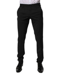 Pantalon homme formel noir en polyester de la marque Dolce & Gabbana, coupe tapered, style élégant et moderne.