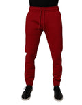 Pantalon jogger en coton rouge Dolce & Gabbana avec logo DG, pour homme, vue de face.