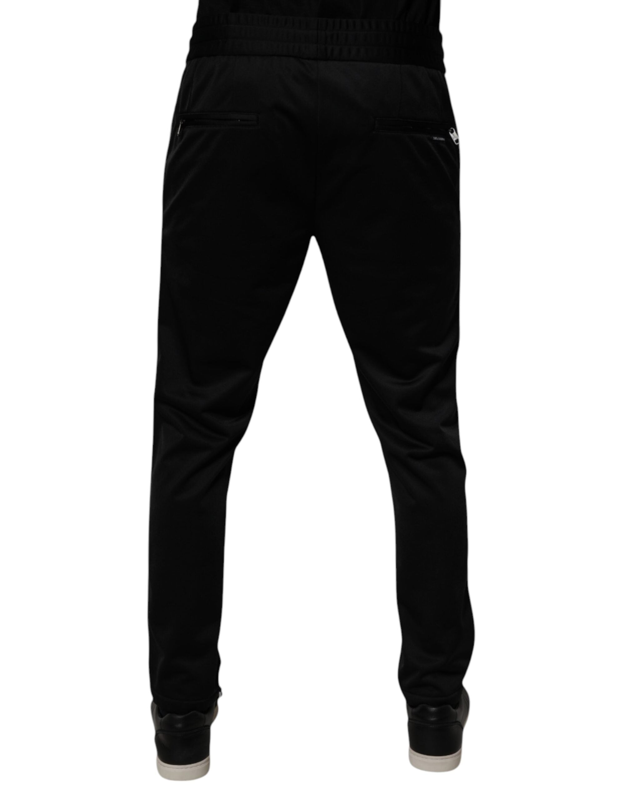 Pantalon jogger pour homme Dolce & Gabbana en polyester noir, style décontracté avec ceinture élastique et poches latérales.
