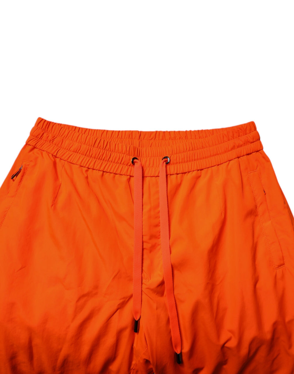 Pantalon jogging pour homme Dolce & Gabbana en polyester orange, style décontracté avec poches et taille élastique.