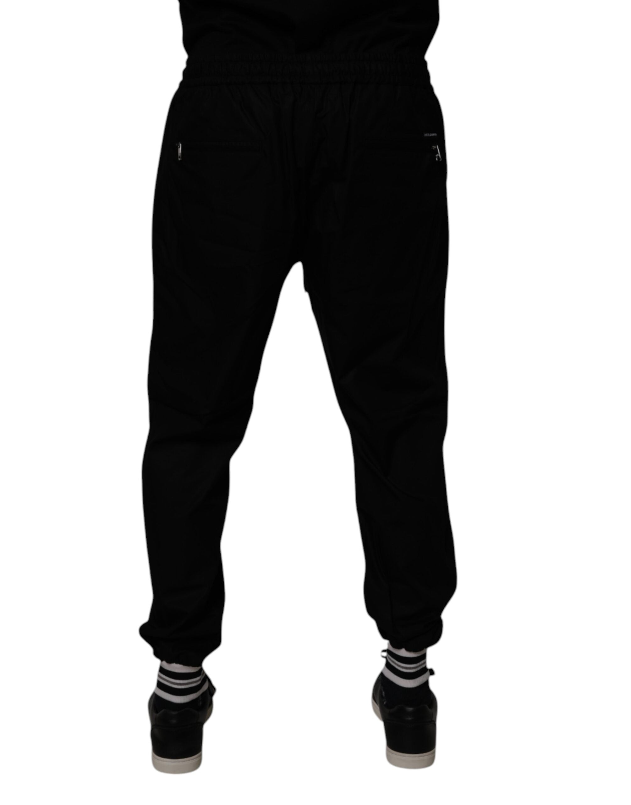 Pantalon jogging homme Dolce & Gabbana en coton noir, style décontracté et confortable, avec poches latérales.