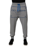 Pantalon de jogging pour homme Dolce & Gabbana en coton gris avec logo, style décontracté et confortable.