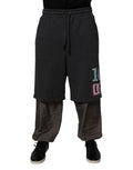 Pantalon Dolce & Gabbana en coton gris foncé, coupe droite et superposée, style sweatpants décontracté.