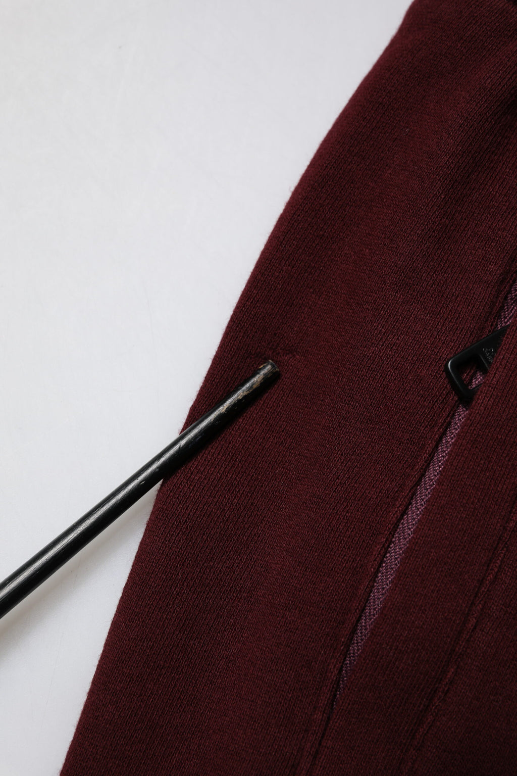 Pantalon de jogging homme Dolce & Gabbana en coton bordeaux, style décontracté avec taille élastique et poches latérales.