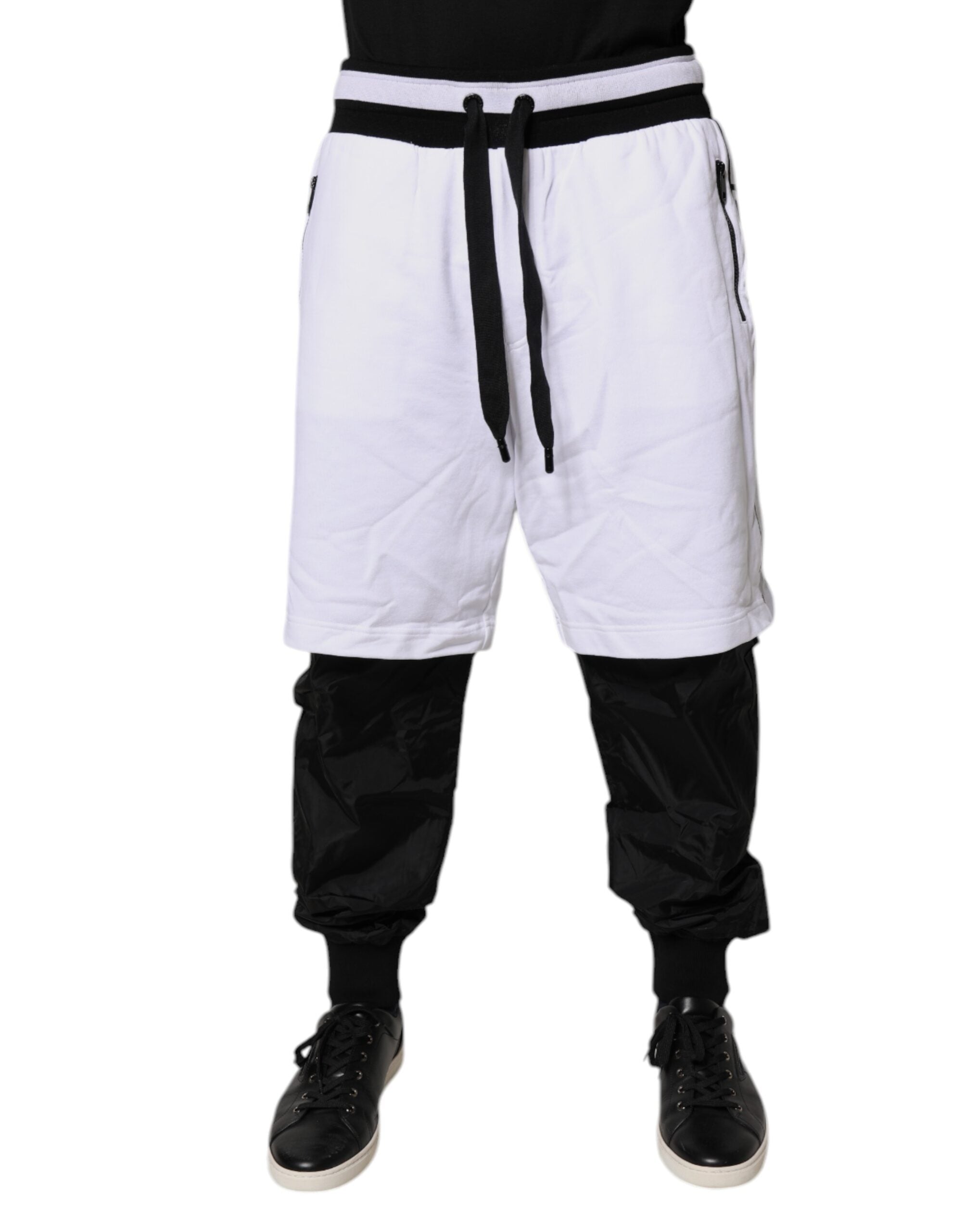 Pantalons de survêtement en coton noir et blanc Dolce & Gabbana avec superposition, pour un style décontracté et tendance.