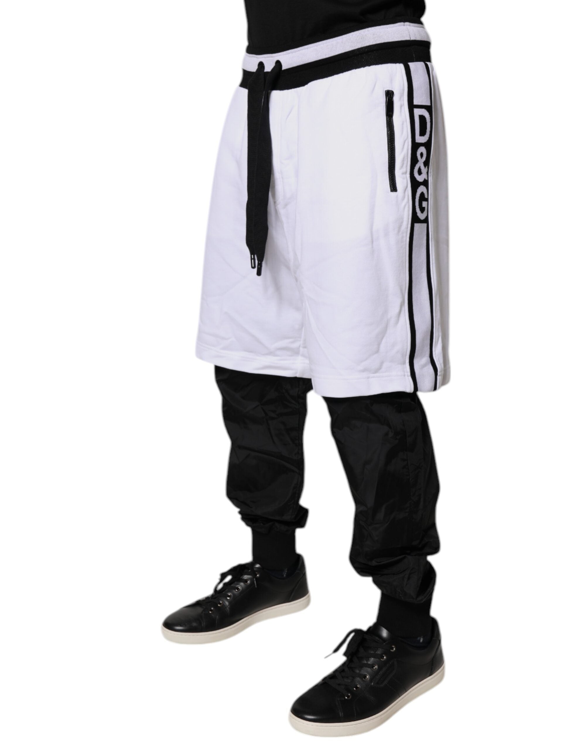 Pantalons sweat en coton noir et blanc de Dolce & Gabbana, style superposé, pour homme ou femme.