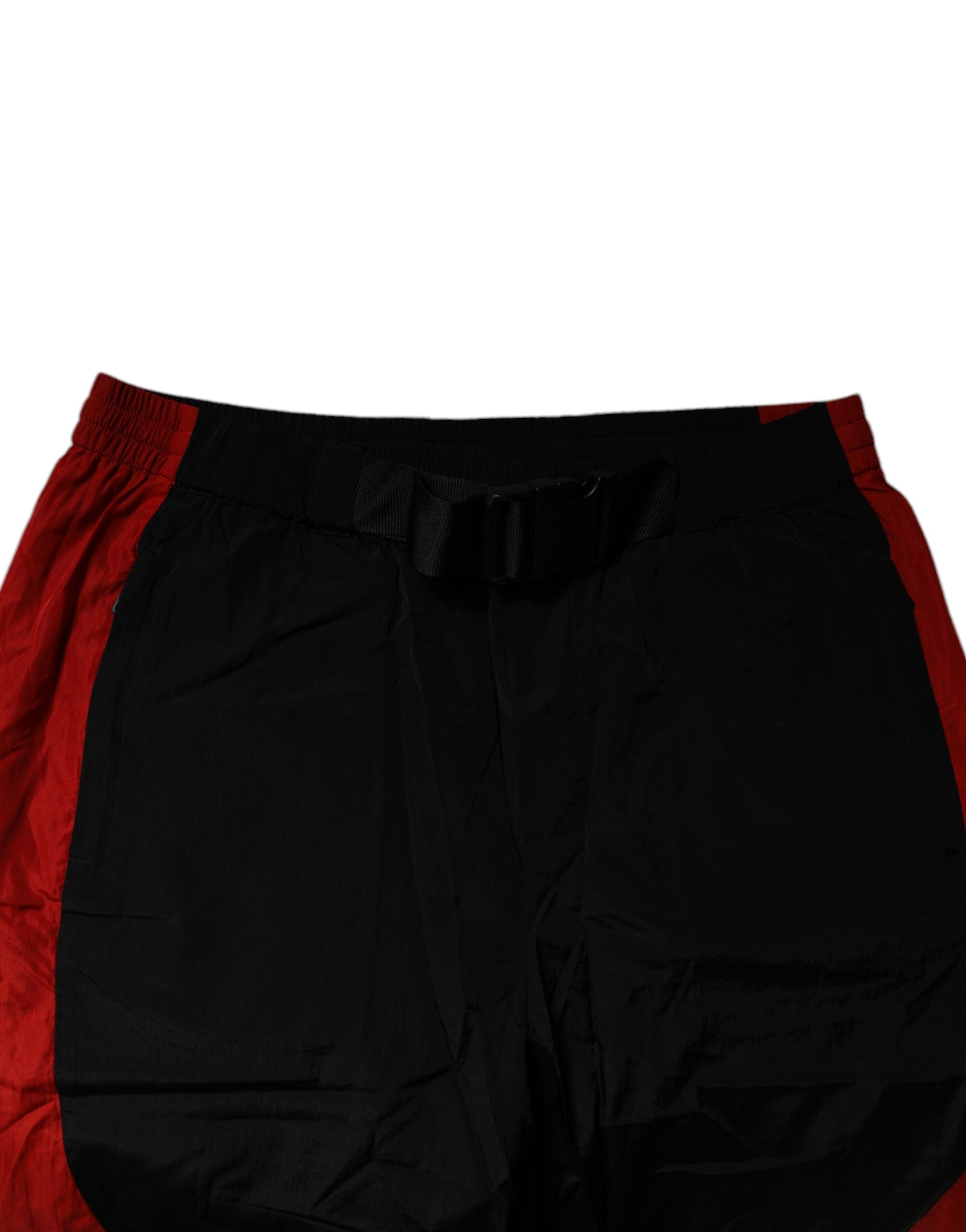 Pantalon jogging Dolce & Gabbana noir et rouge à motif léopard, style décontracté avec ceinture élastique et poches latérales.