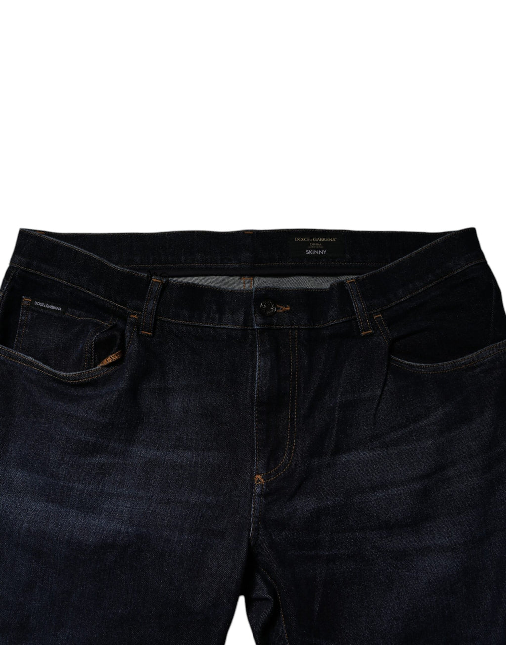 Jeans skinny en denim stretch bleu foncé Dolce & Gabbana, en coton, affichant une coupe ajustée et des détails modernes.
