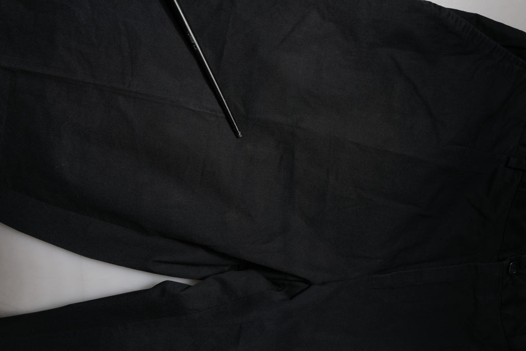 Pantalon habillé noir en coton stretch Dolce & Gabbana, pantalon skinny formel pour femmes, détail de la couture élégante.
