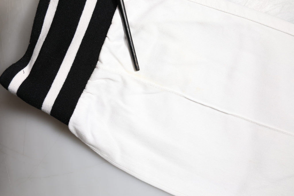 Pantalons jogger cargo en coton blanc Dolce & Gabbana, coupe skinny, avec poches et détails décontractés.
