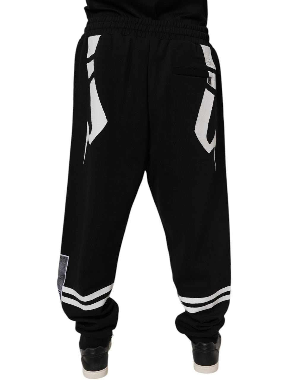 Pantalons de jogging en coton noir Dolce & Gabbana avec logo, style décontracté et confortable, vue de face.