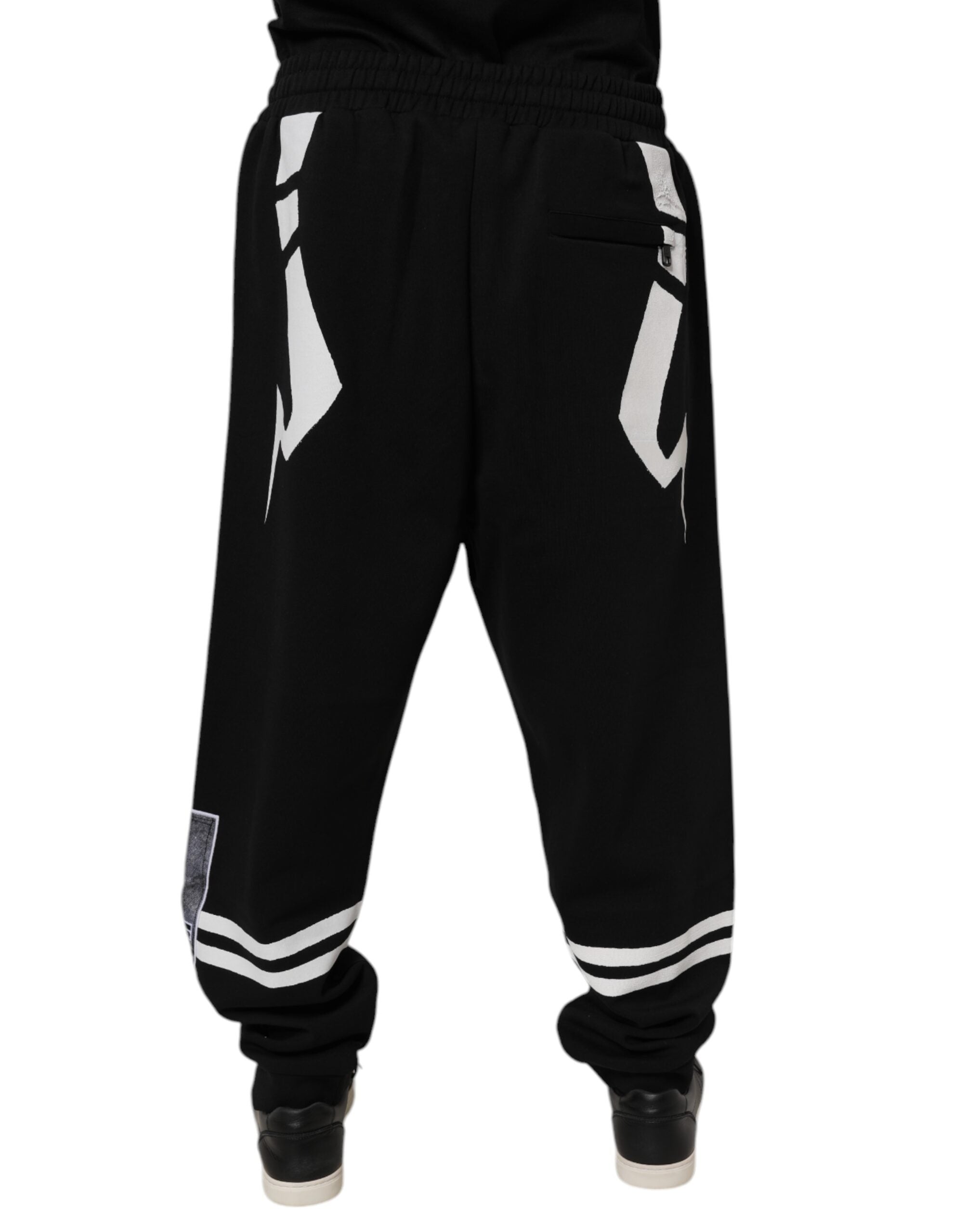 Pantalons de jogging en coton noir Dolce & Gabbana avec logo, style décontracté et confortable, vue de face.