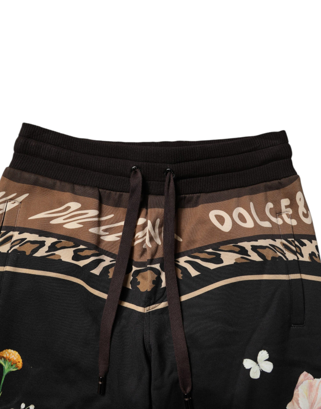 Pantalon de jogging Dolce & Gabbana en coton noir avec motif floral, style décontracté et confortable.