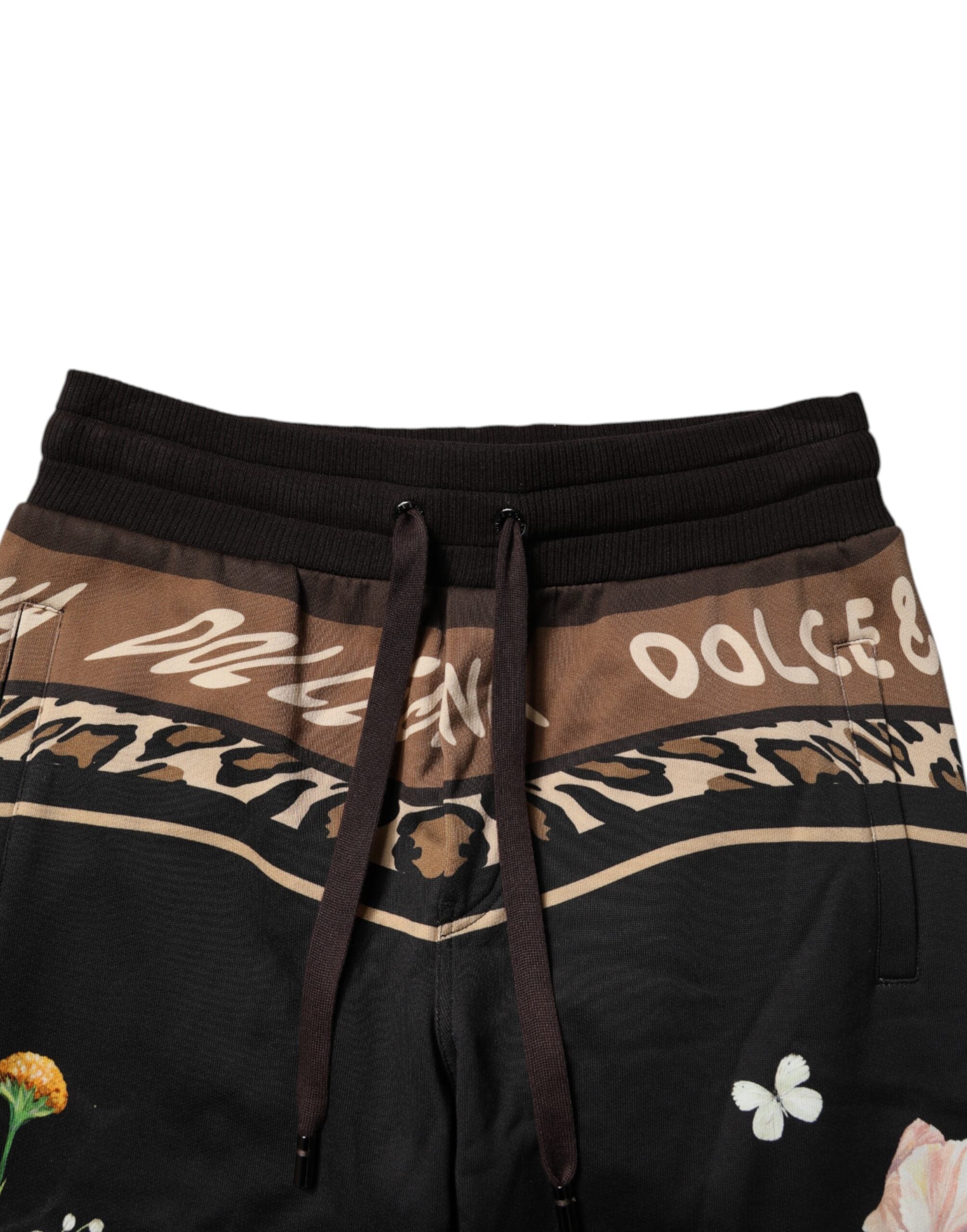 Pantalon de jogging Dolce & Gabbana en coton noir avec motif floral, style décontracté et confortable.