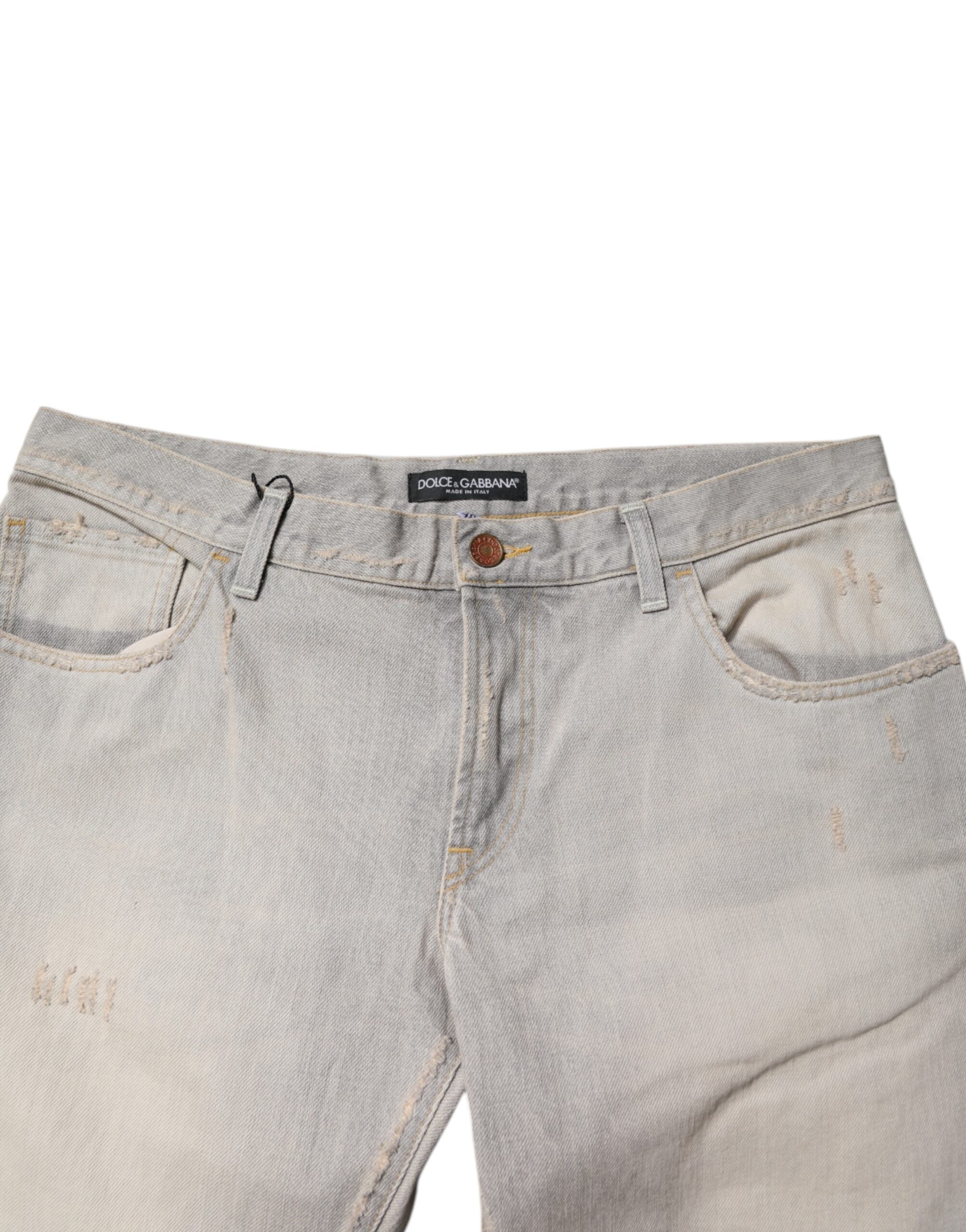 Jeans skinny en coton gris clair de Dolce & Gabbana, coupe ajustée avec détails denim, porté sur mannequin.
