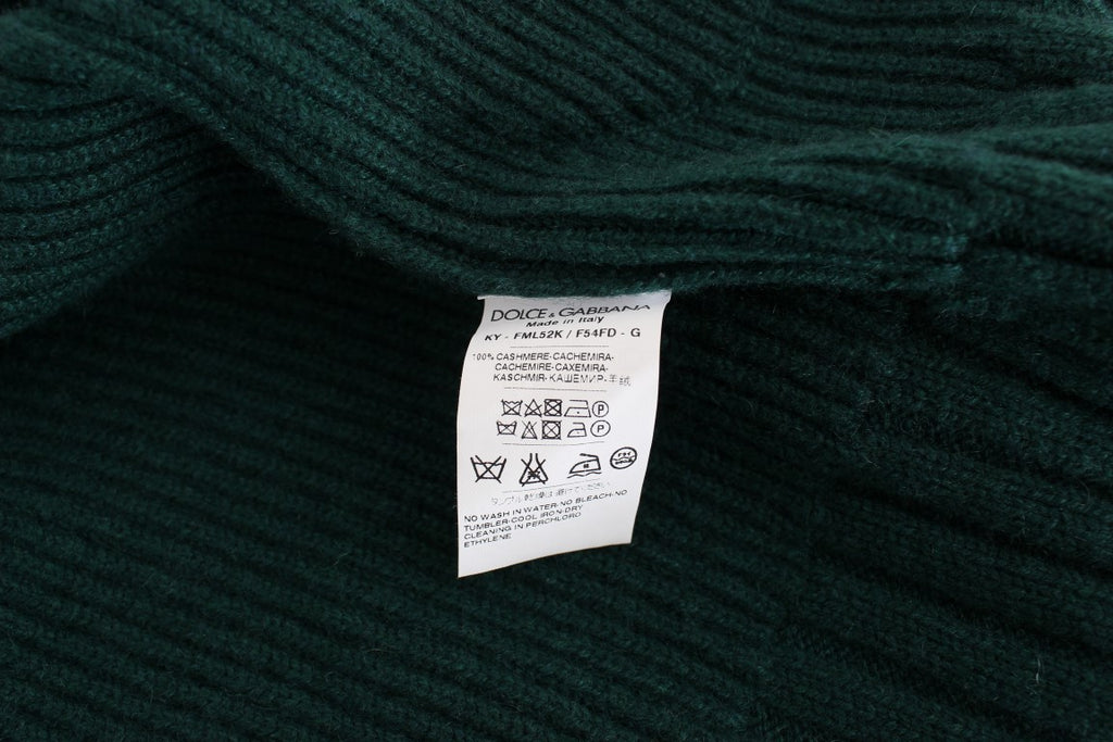 Cardigan en cachemire vert Dolce & Gabbana, tricoté, avec détails élégants et coupe classique, porté ou posé à plat.