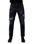 Jeans skinny en coton bleu foncé déchiré de Dolce & Gabbana, style décontracté avec détails usés.