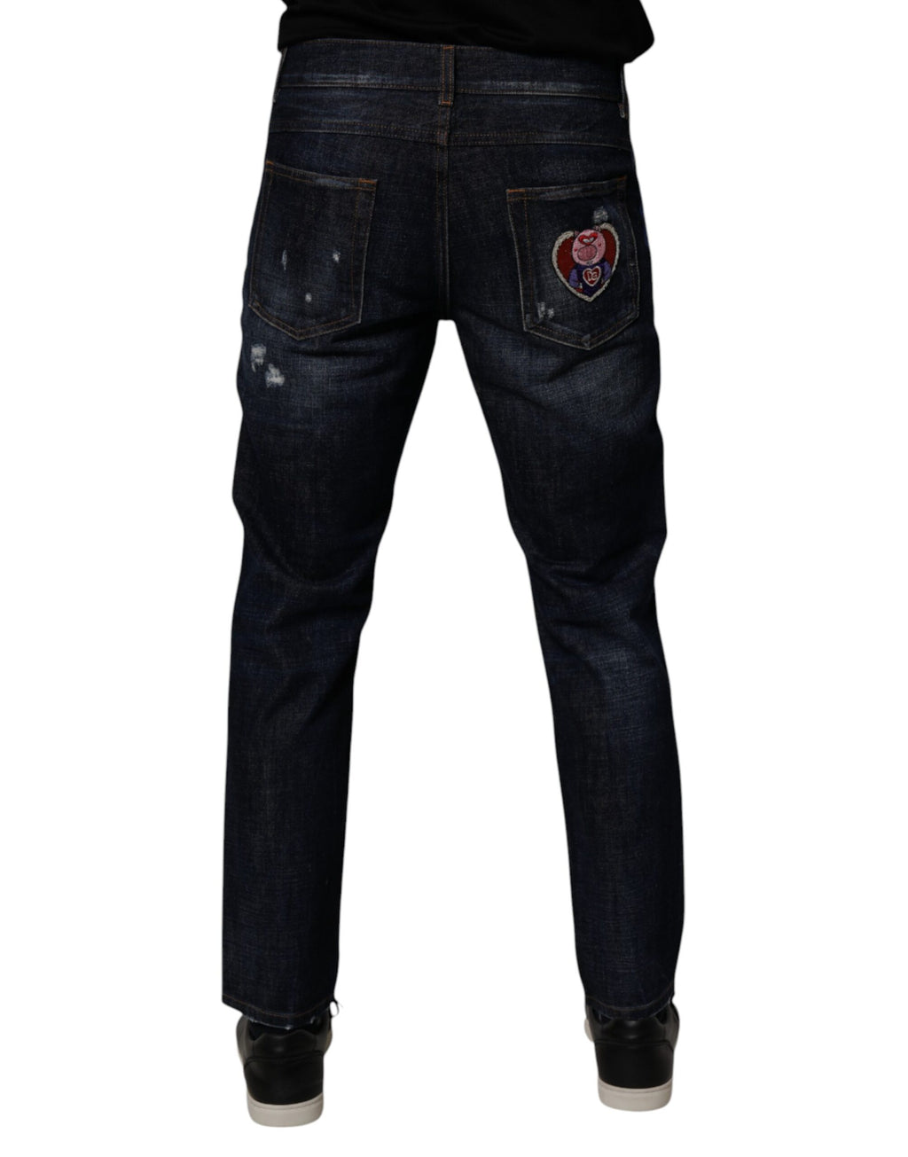 Jeans skinny en denim bleu foncé tâcheté en coton de Dolce & Gabbana, style déchiré et tendance.
