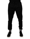 Pantalon de jogging Dolce & Gabbana en coton stretch noir, coupe décontractée et détails modernes visible sur l'image.