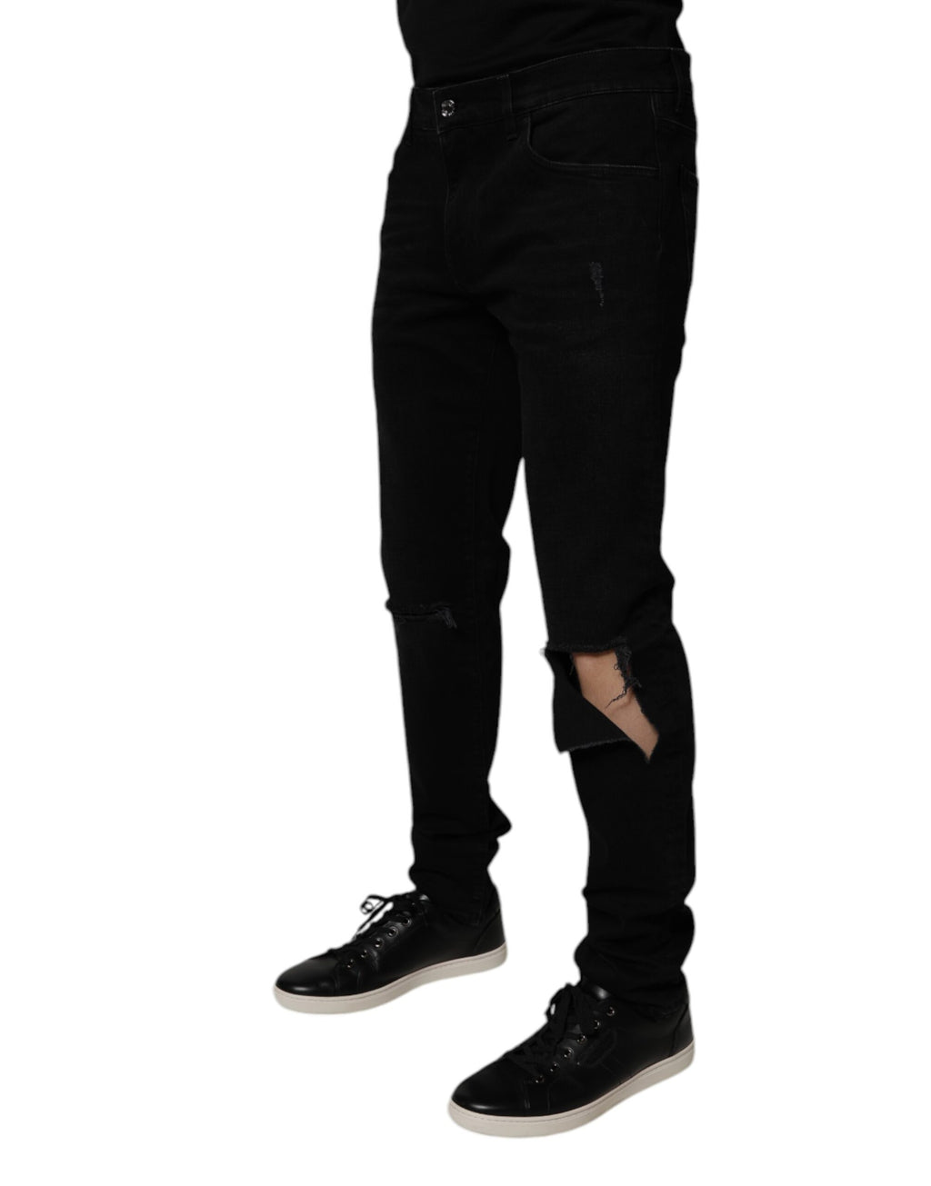 Jeans homme en denim noir Dolce & Gabbana, coupe skinny tachetée en coton avec déchirures pour un look décontracté.