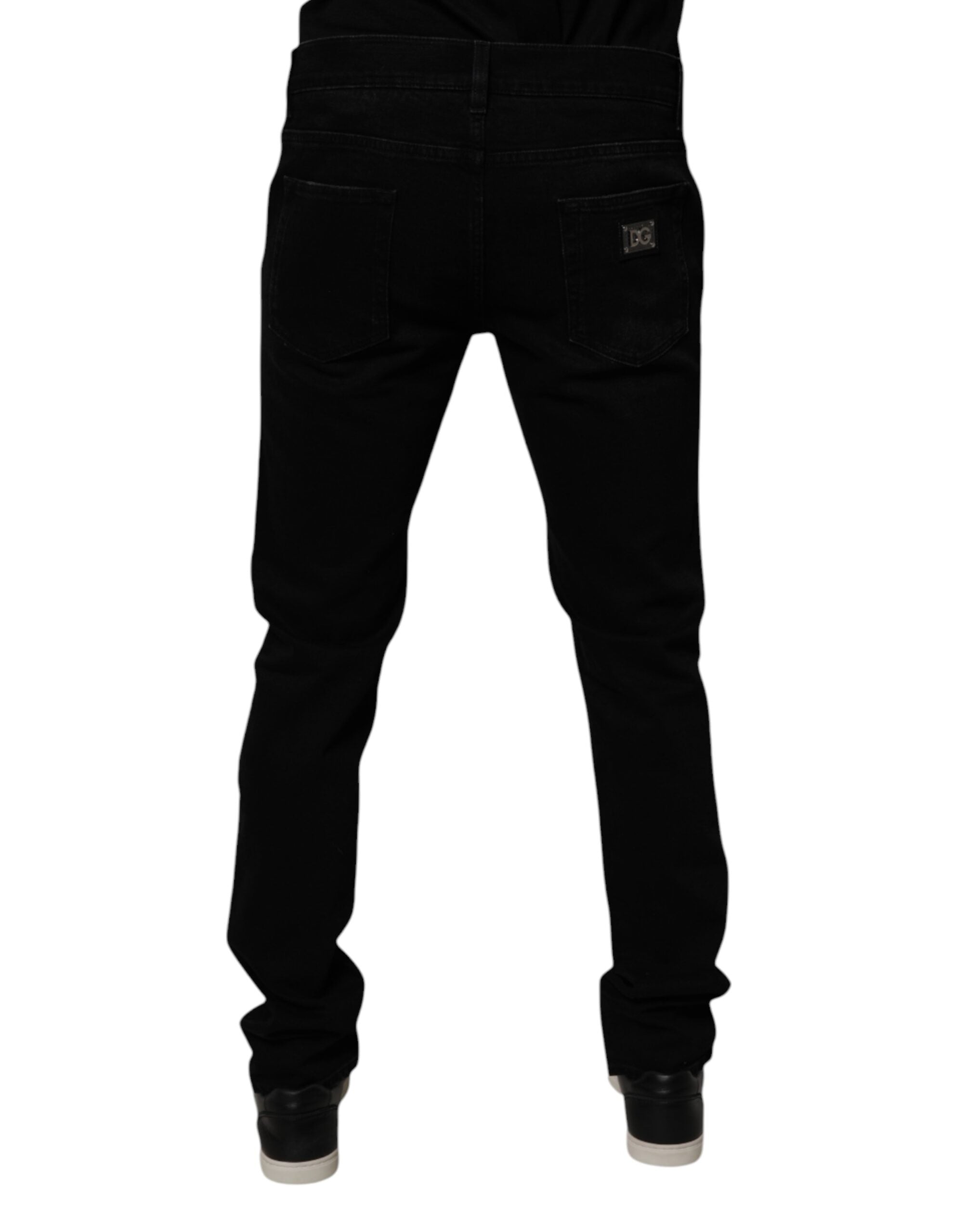 Jeans homme skinny en denim noir tacheté en coton de Dolce & Gabbana, style déchiré et ajusté.