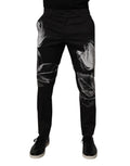 Pantalons slim en coton noir à motifs floraux de Dolce & Gabbana, style élégant et moderne.
