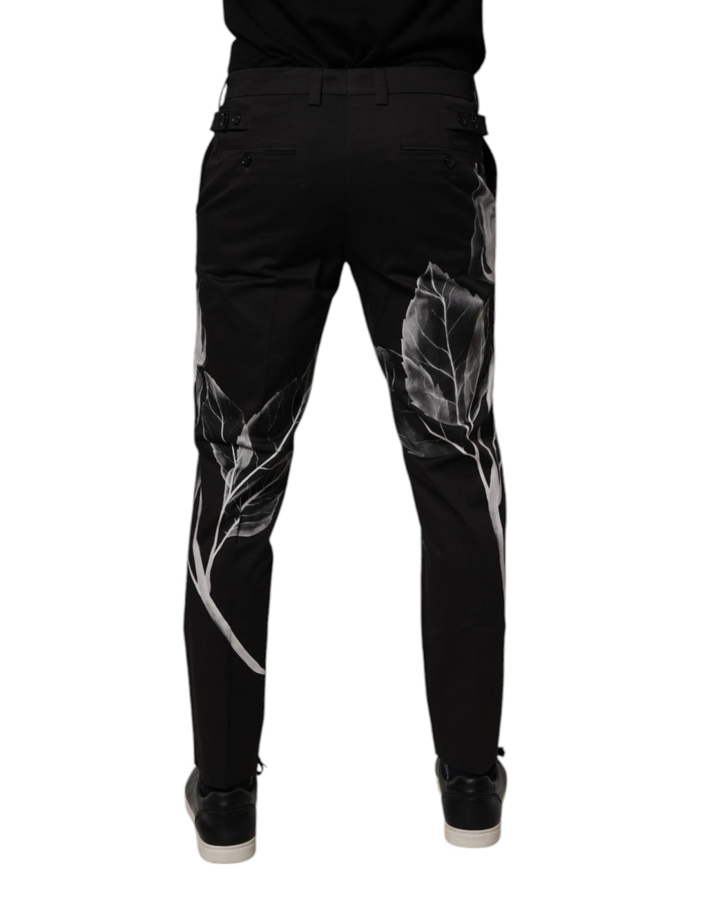 Pantalon skinny Dolce & Gabbana en coton noir avec motif floral, vue de face.