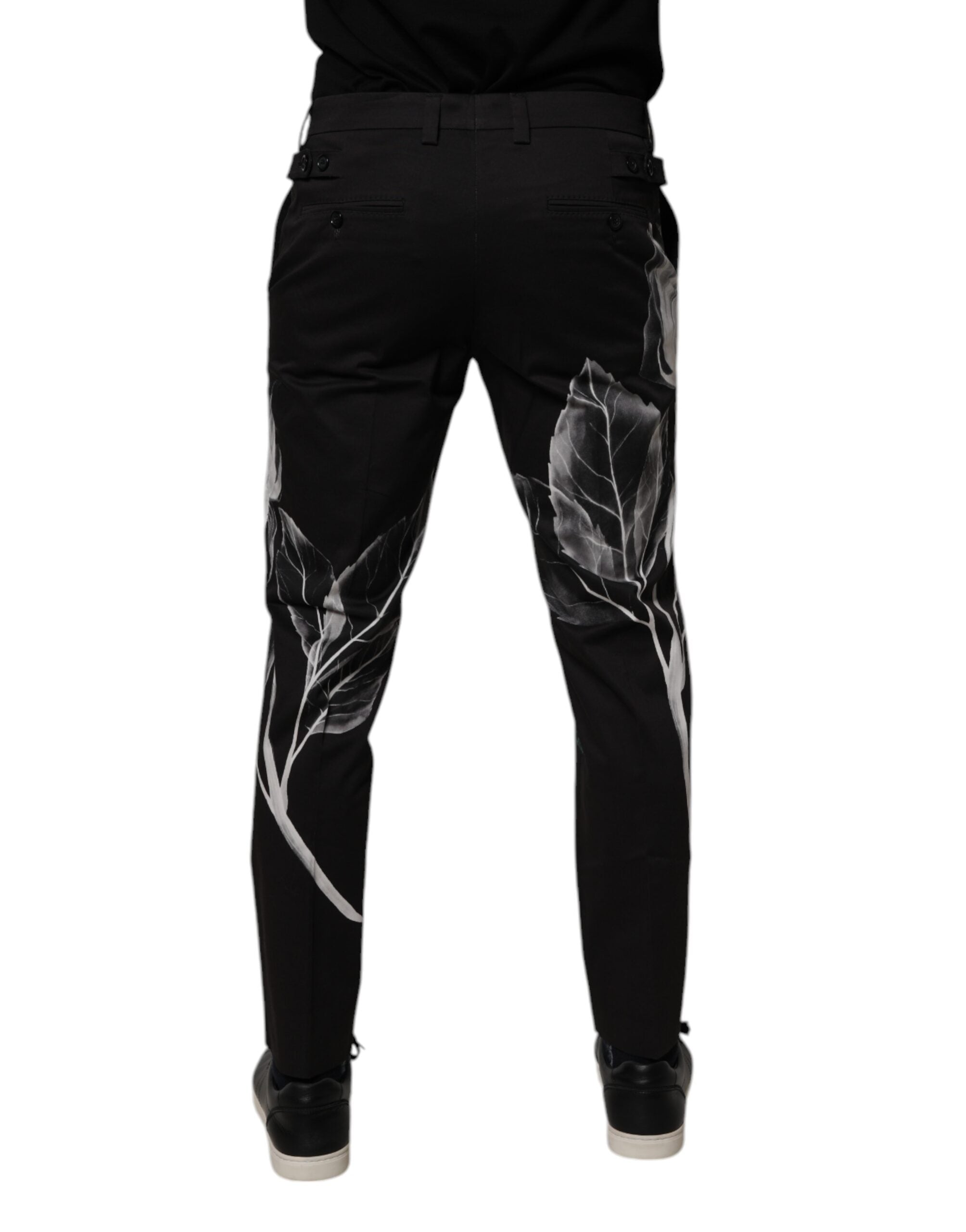 Pantalon skinny Dolce & Gabbana en coton noir avec motif floral, vue de face.