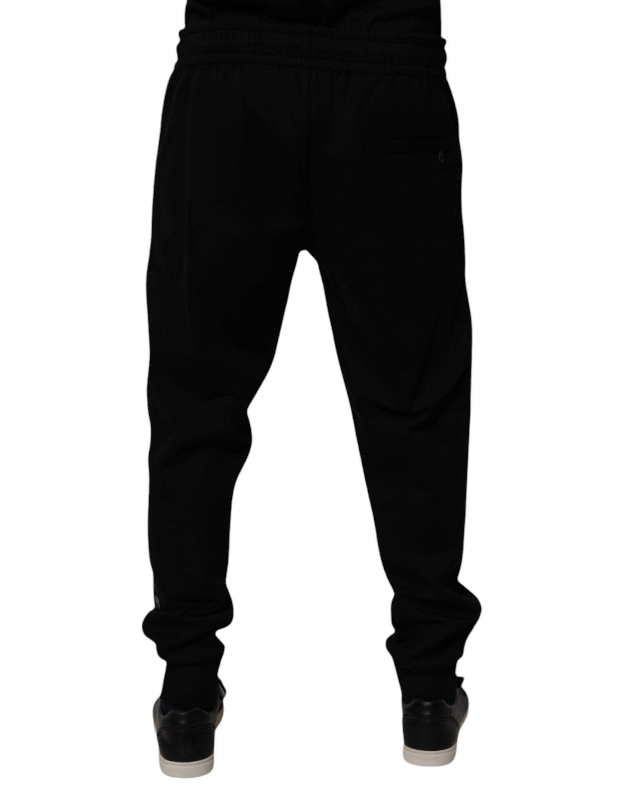 Pantalons joggers Dolce & Gabbana en coton mélangé noir, coupe décontractée avec ceinture élastique et détails élégants.