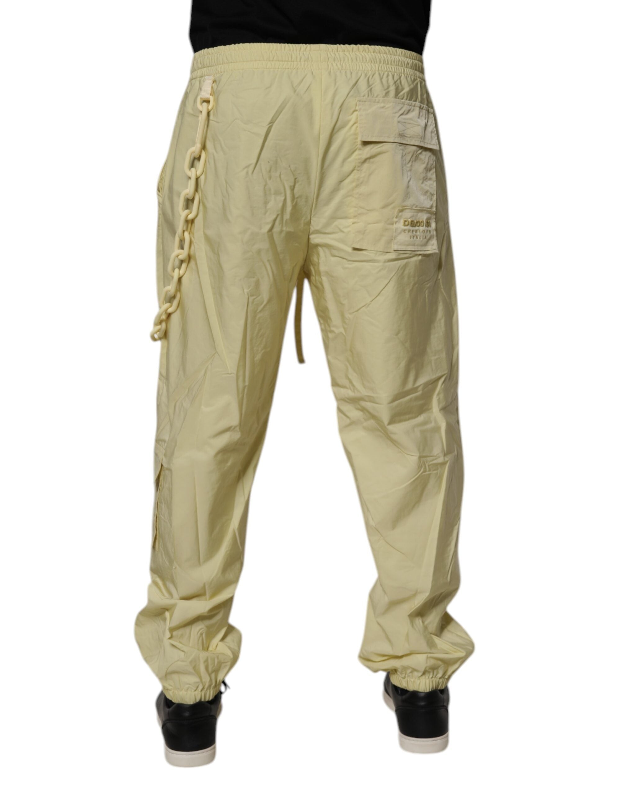 Pantalons jogger pour hommes Dolce & Gabbana en nylon jaune avec chaîne cargo, style décontracté et tendance.