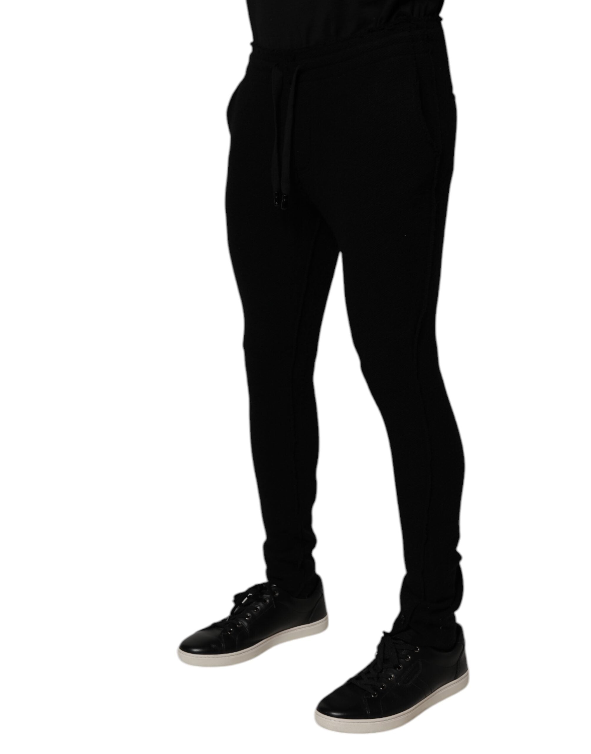 Pantalon de jogging Dolce & Gabbana en cachemire noir pour homme, vue de face avec détails de couture.