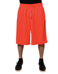 Shorts bermuda pour hommes en polyester rouge de marque Dolce & Gabbana, coupe mi-hauteur, tissus légers et élégants.