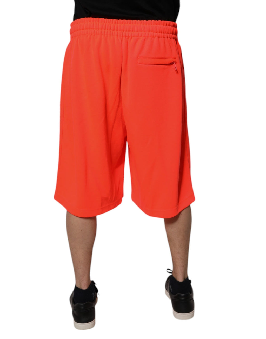 Shorts bermuda homme rouge en polyester Dolce & Gabbana, taille mi-hauteur, vue de face sur fond neutre.