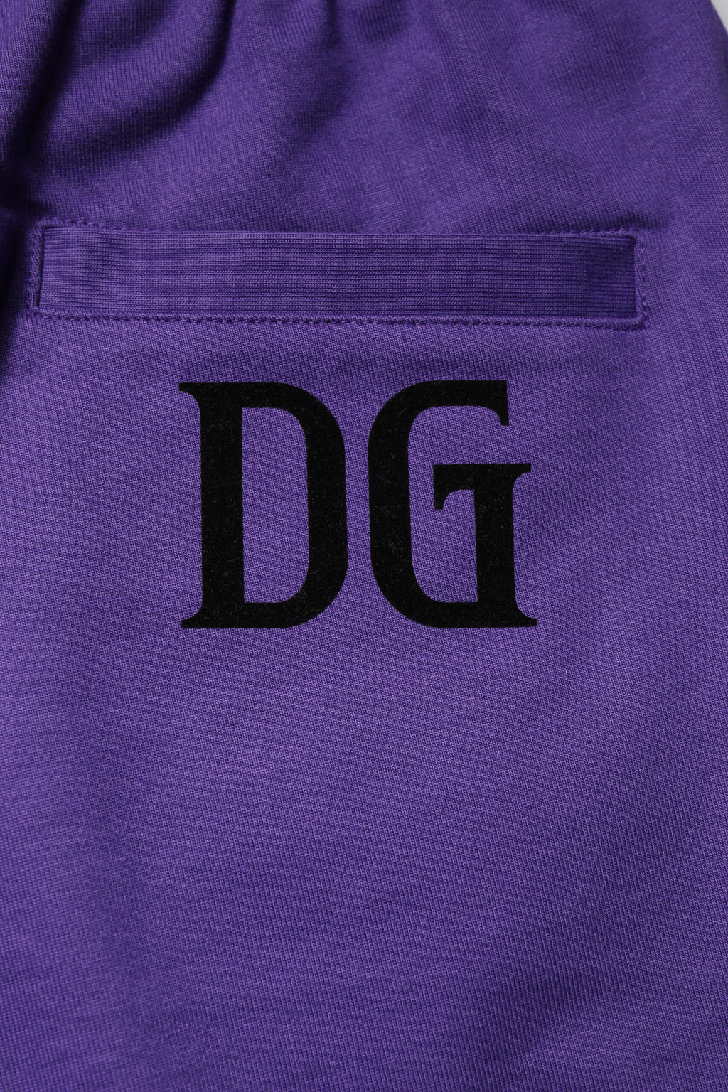 Shorts bermuda pour homme Dolce & Gabbana en coton violet, style décontracté et confortable.