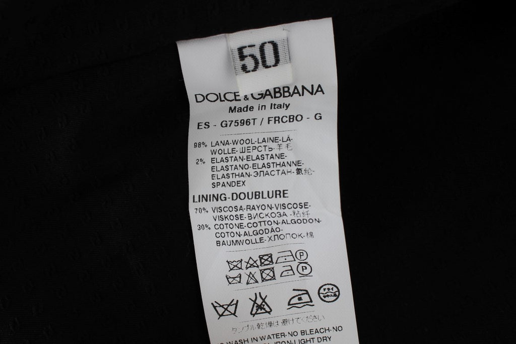 Gilet formel gris à rayures Dolce & Gabbana, élégant, ajusté, avec col en V et fermeture à boutons.