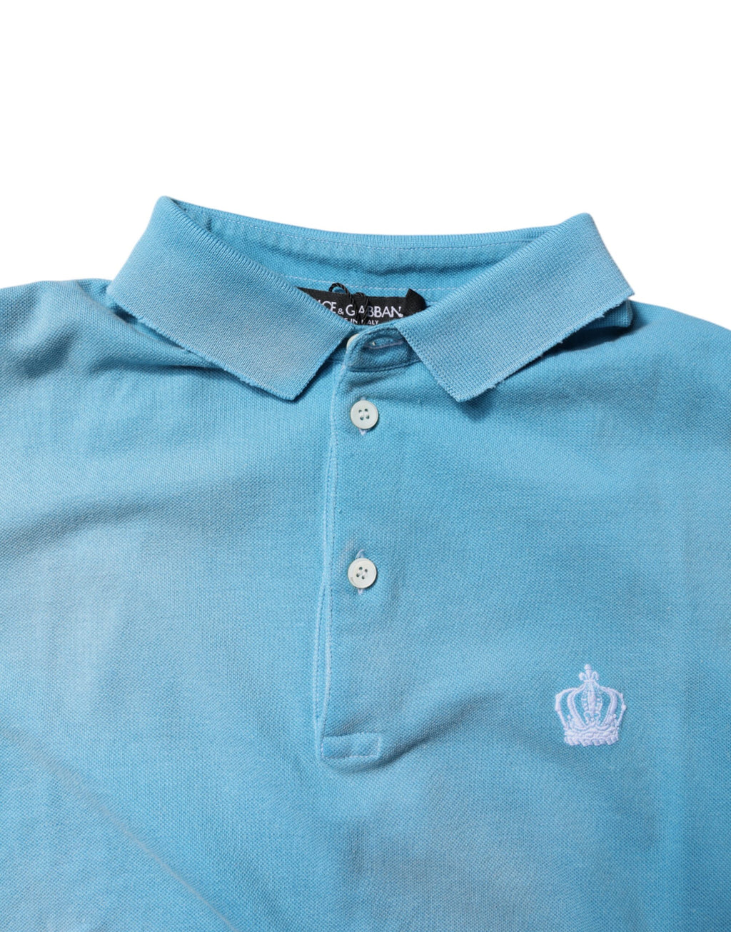 Polo homme Dolce & Gabbana en coton bleu avec col en forme de couronne, vue de face.