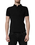 Polo noir en coton Dolce & Gabbana avec col et logo DG visible, style élégant pour homme.