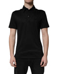 Polo en polyester noir Dolce & Gabbana avec col et logo DG visible sur le devant.
