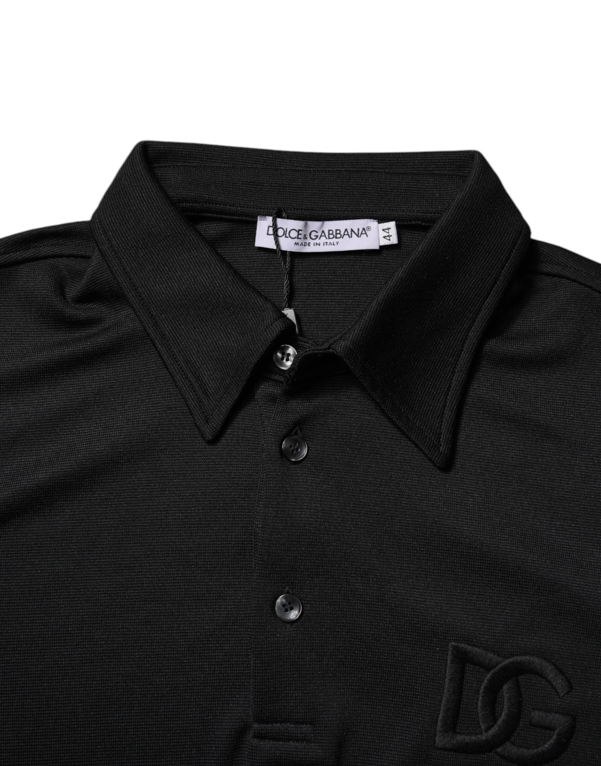 Polo noir en polyester Dolce & Gabbana avec logo DG, col classique, vue de face.