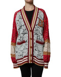 Cardigan en dentelle florale multicolore de Dolce & Gabbana, pull élégant avec motifs fleuris, vue de face sur fond neutre.