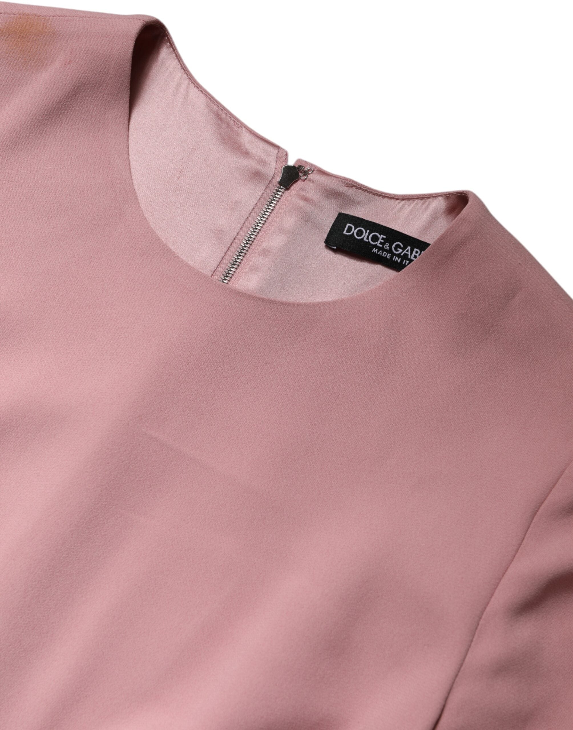 Robe Dolce & Gabbana rose en viscose à ligne évasée, manches 3/4, style élégant et féminin.