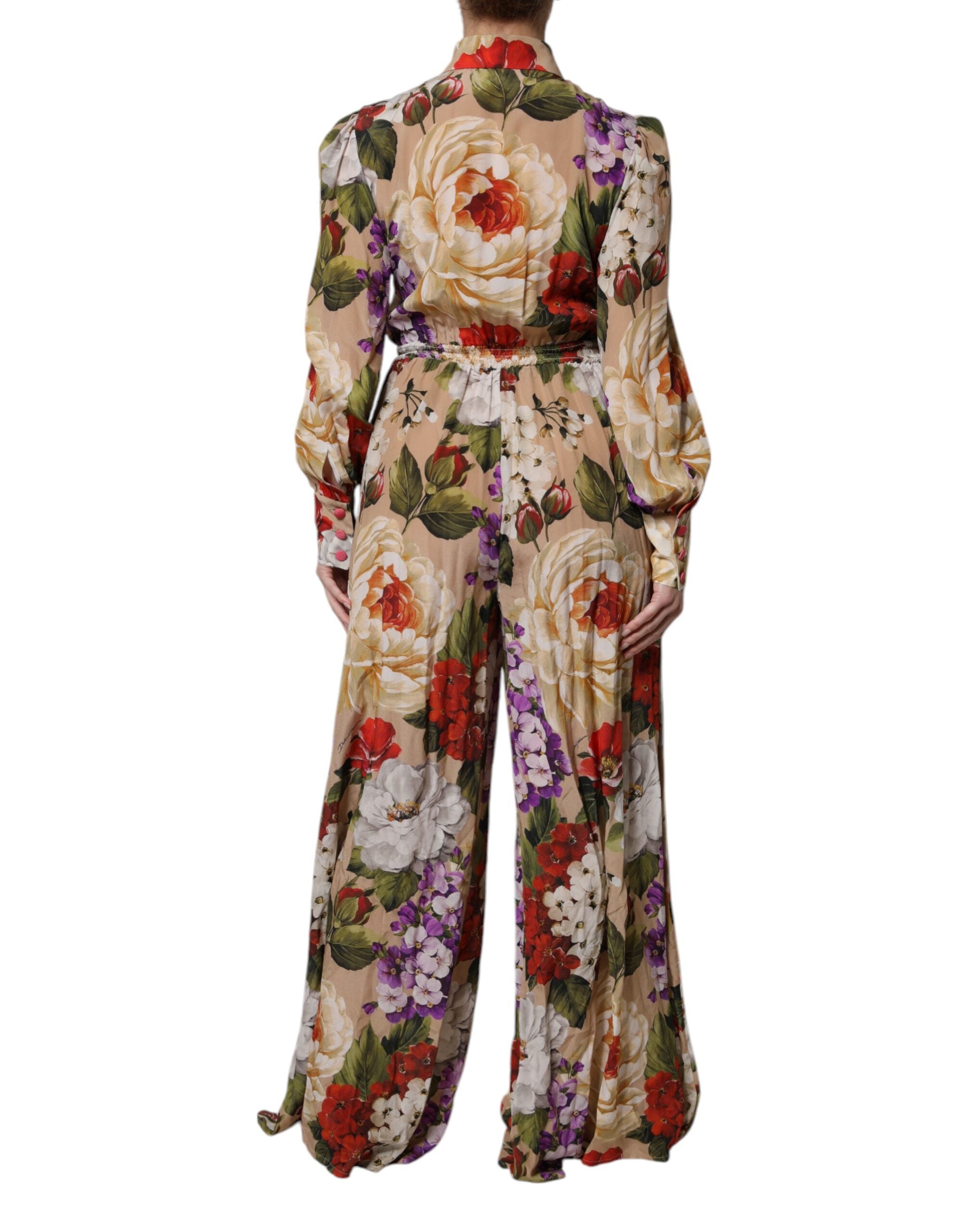 Combinaison pantalon Dolce & Gabbana à fleurs multicolores, coupe large, élégante et fluide, portée avec style.