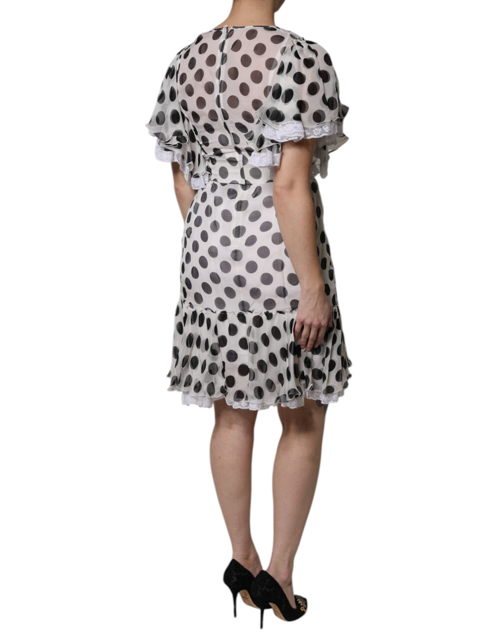 Robe blanche à pois en soie mélangée de Dolce & Gabbana, coupe évasée et élégante, pour un style sophistiqué.