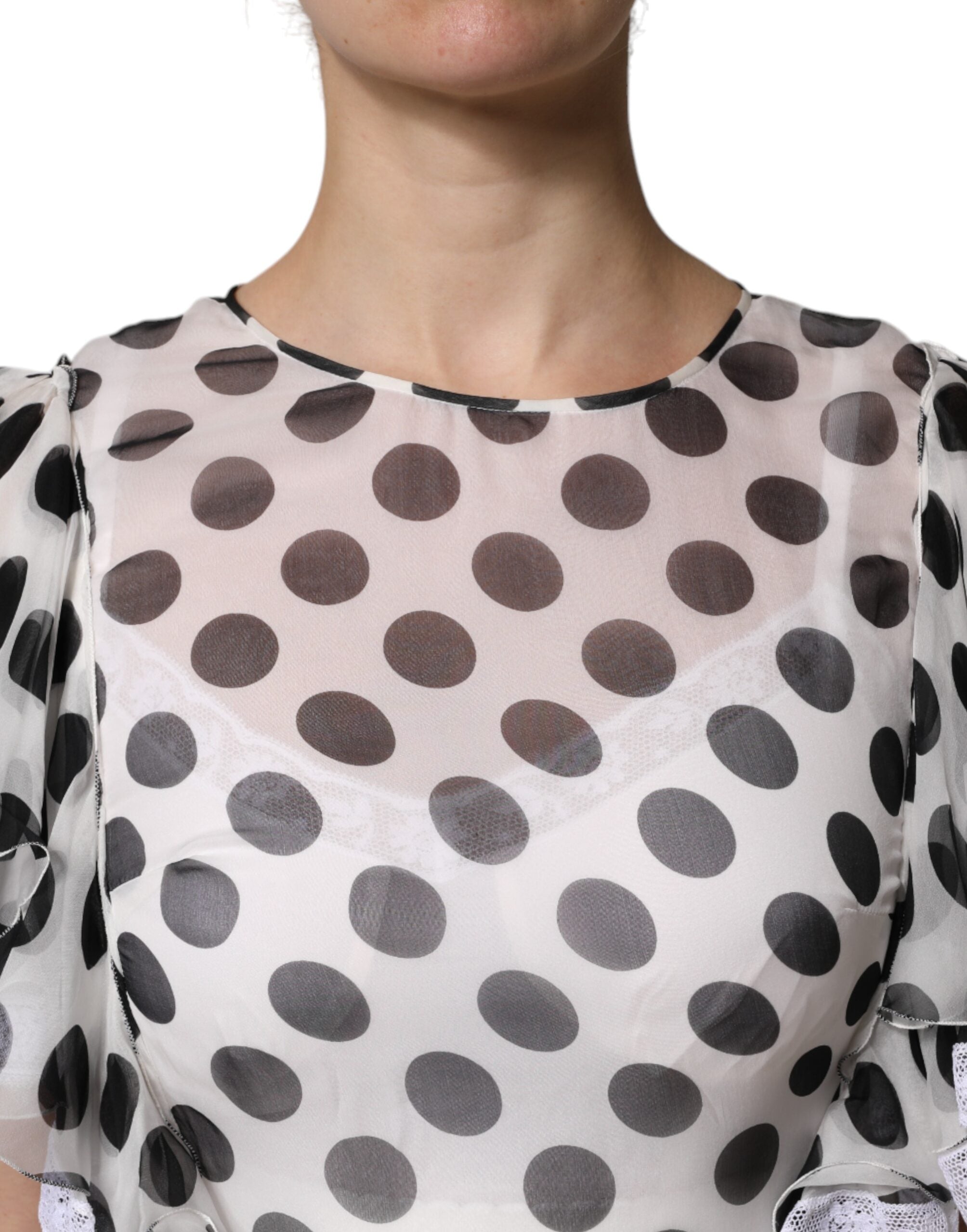 Robe blanche à pois en soie mélangée de Dolce & Gabbana, coupe évasée et élégante, pour un style sophistiqué et féminin.