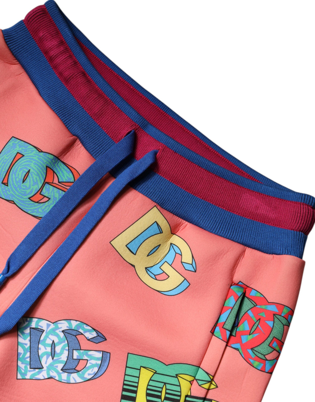 Pantalon de jogging Dolce & Gabbana rose avec logo monogramme, tissu doux et confortable, style décontracté et élégant.