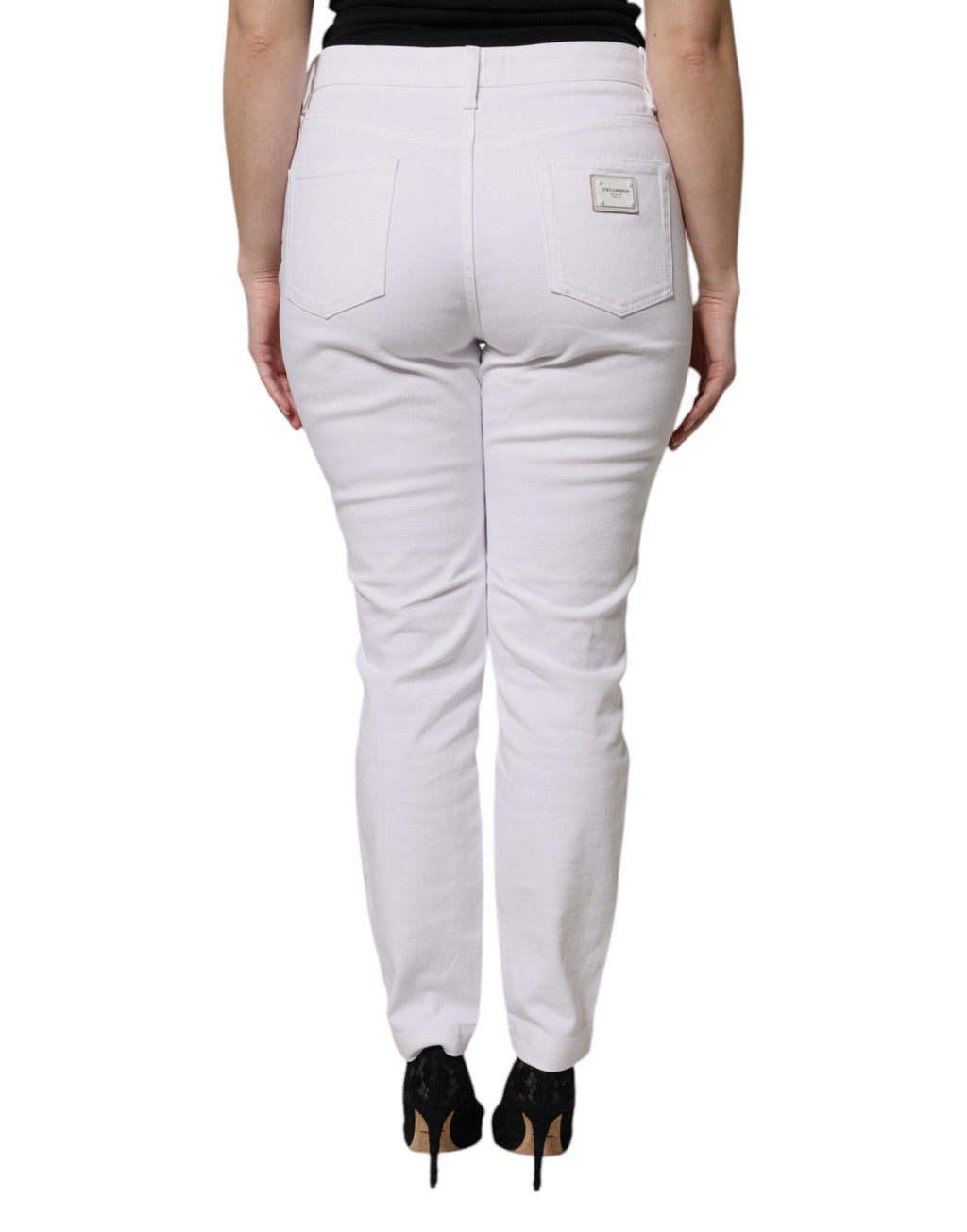 Jeans décontractés en coton blanc Dolce & Gabbana, coupe skinny taille moyenne, style moderne et confortable.