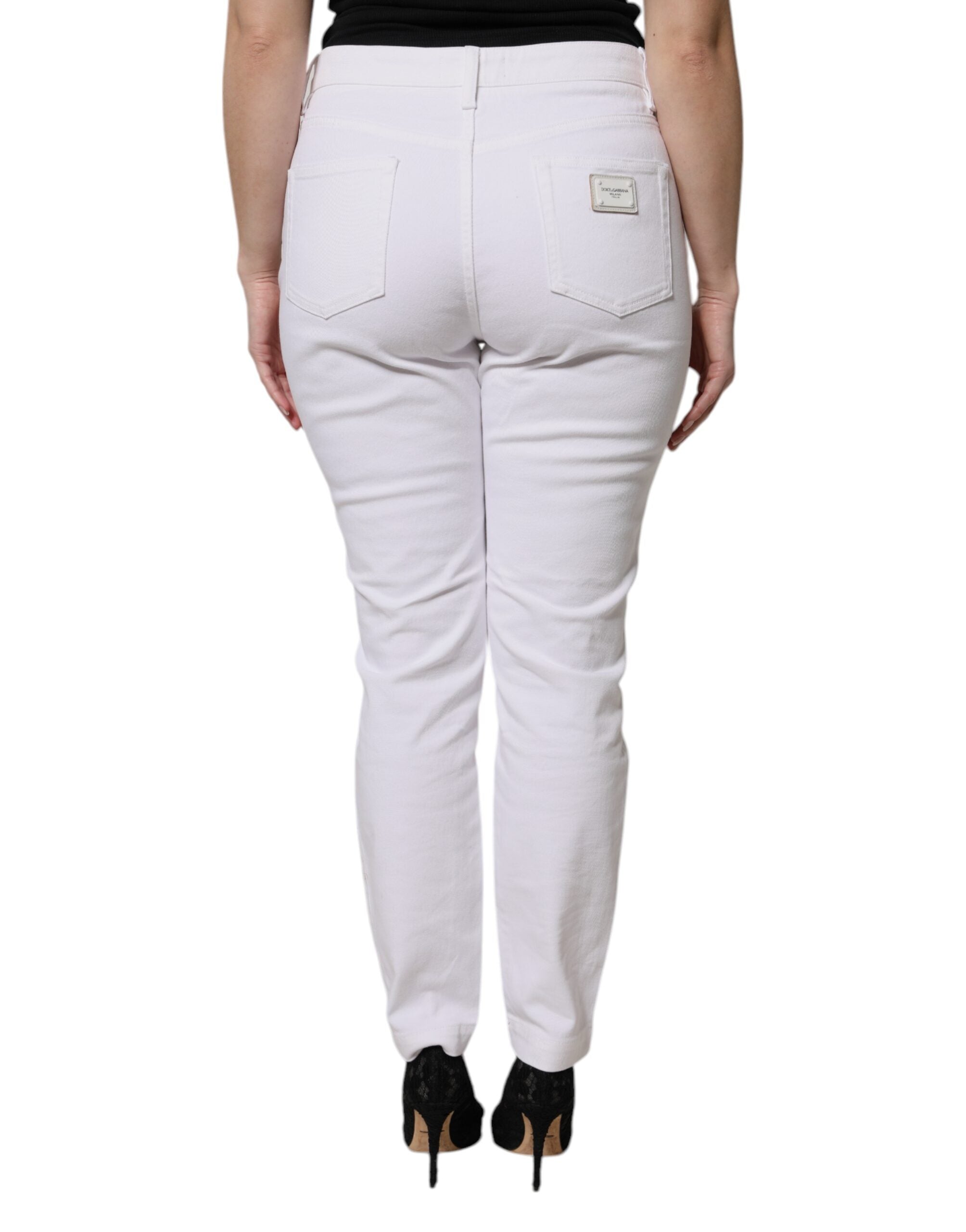 Jeans décontractés en coton blanc Dolce & Gabbana, coupe skinny taille moyenne, style moderne et confortable.