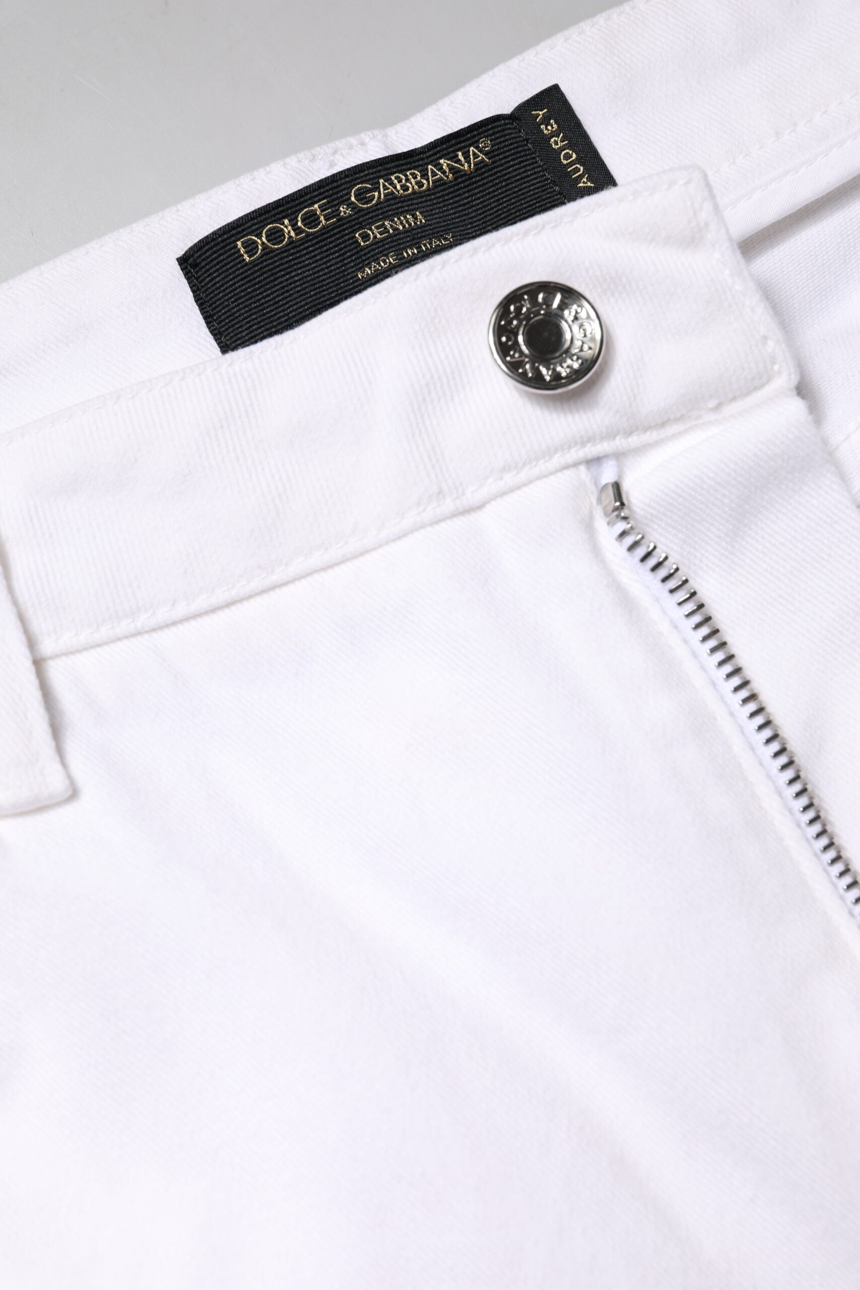 Jeans skinny en coton blanc à taille moyenne de Dolce & Gabbana, coupe ajustée et moderne.